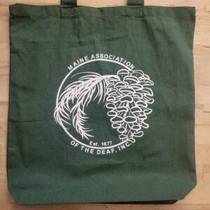 Green reusable canvas bag with white MeAD Logo printed on the side.